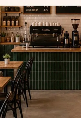 The bar, with green tiling and the coffee machine on the counter